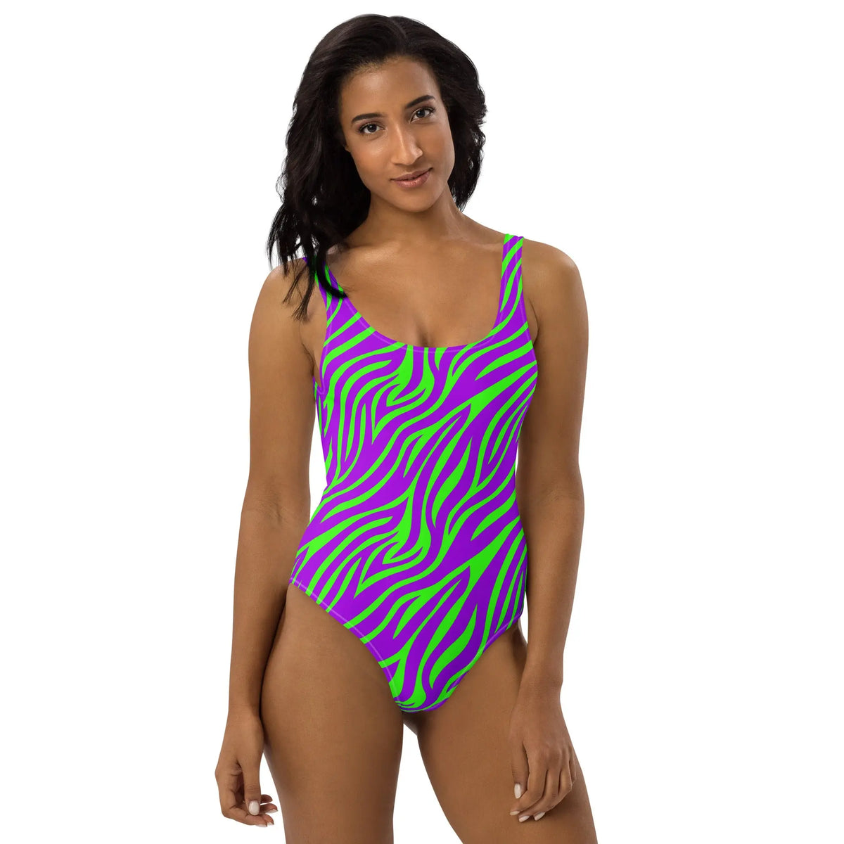 Purple and green neon zebra print one-piece swimsuit with high-cut legs and scoop back, styled in a bold Y2K retro design.