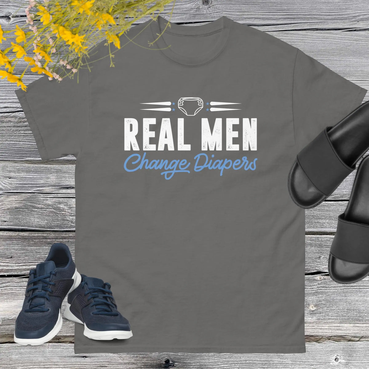 Celebrate fatherhood with our exclusive Father's Day charcoal t-shirt! Crafted from 100% premium cotton, showcasing a bold statement: "Real Men Change Diapers." A declaration of modern fatherhood proudly proclaiming that changing diapers is not just a mom's job—it's a real man's duty!