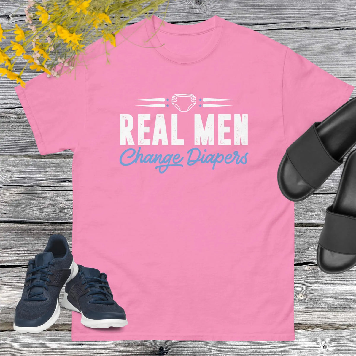 Celebrate fatherhood with our exclusive Father's Day pink t-shirt! Crafted from 100% premium cotton, showcasing a bold statement: "Real Men Change Diapers." A declaration of modern fatherhood proudly proclaiming that changing diapers is not just a mom's job—it's a real man's duty!