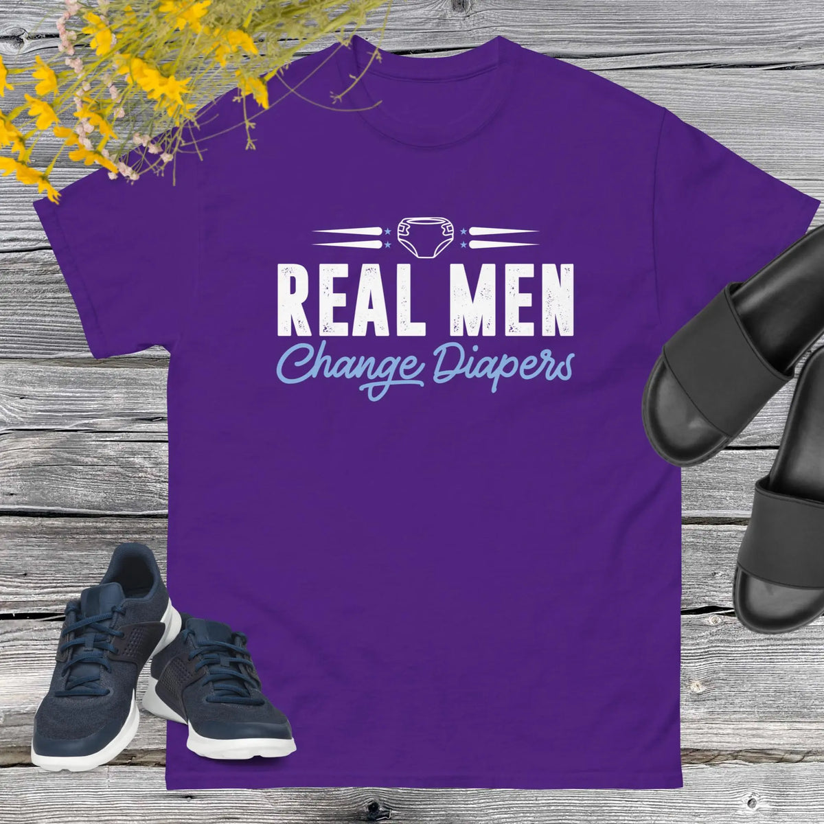 Celebrate fatherhood with our exclusive Father's Day purple t-shirt! Crafted from 100% premium cotton, showcasing a bold statement: "Real Men Change Diapers." A declaration of modern fatherhood proudly proclaiming that changing diapers is not just a mom's job—it's a real man's duty!
