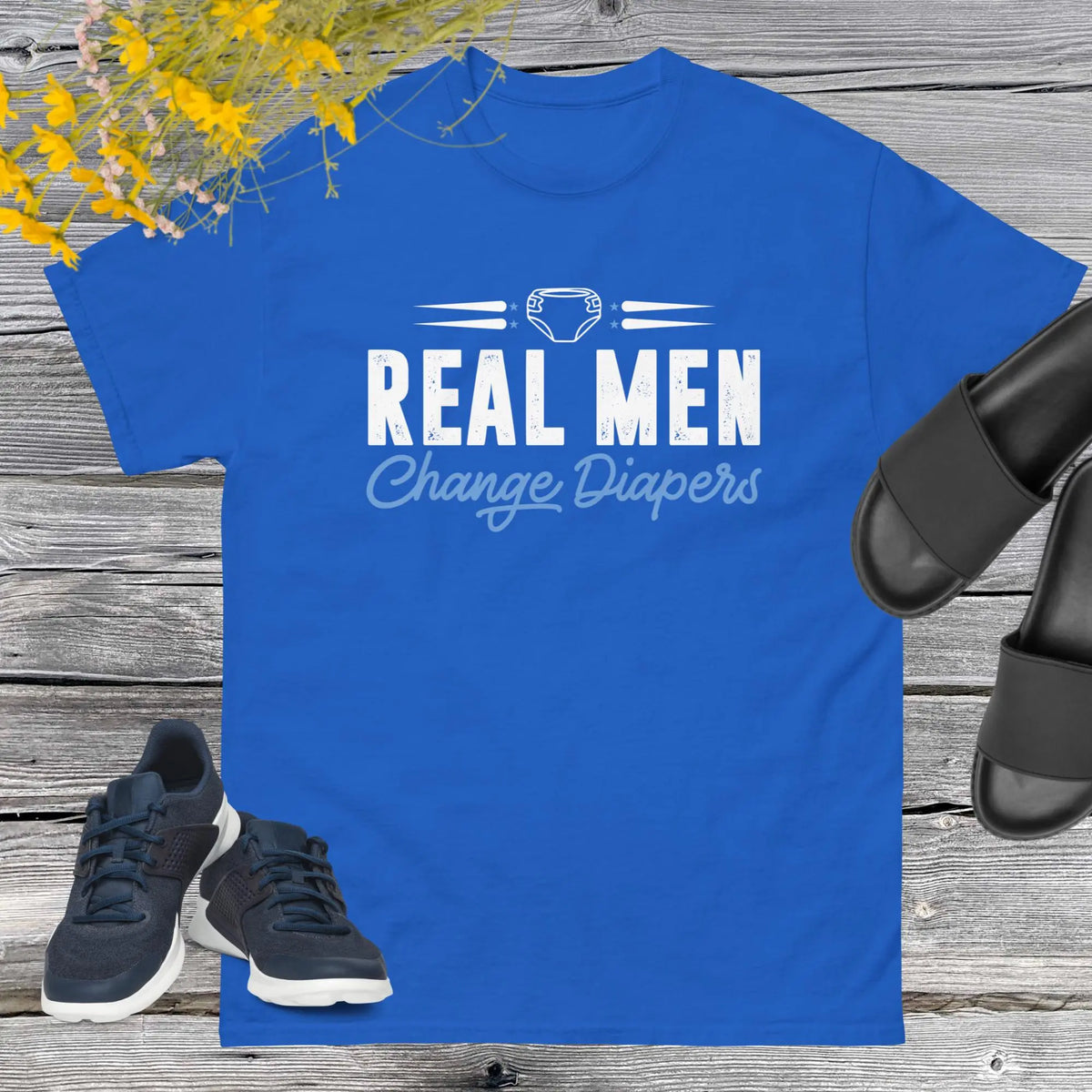 Celebrate fatherhood with our exclusive Father's Day royal blue t-shirt! Crafted from 100% premium cotton, showcasing a bold statement: "Real Men Change Diapers." A declaration of modern fatherhood proudly proclaiming that changing diapers is not just a mom's job—it's a real man's duty!