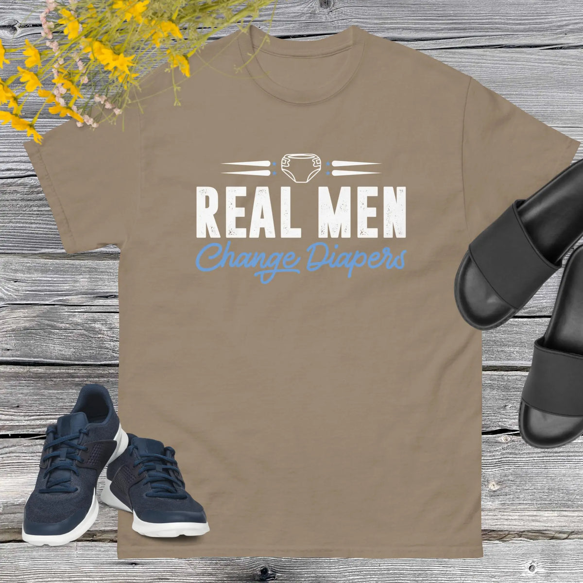 Celebrate fatherhood with our exclusive Father's Day savana t-shirt! Crafted from 100% premium cotton, showcasing a bold statement: "Real Men Change Diapers." A declaration of modern fatherhood proudly proclaiming that changing diapers is not just a mom's job—it's a real man's duty!