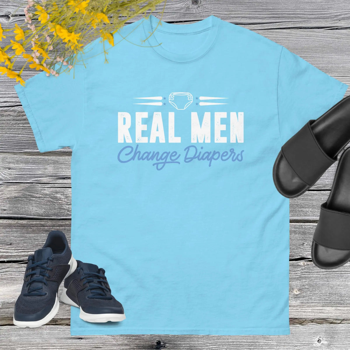 Celebrate fatherhood with our exclusive Father's Day sky blue t-shirt! Crafted from 100% premium cotton, showcasing a bold statement: "Real Men Change Diapers." A declaration of modern fatherhood proudly proclaiming that changing diapers is not just a mom's job—it's a real man's duty!