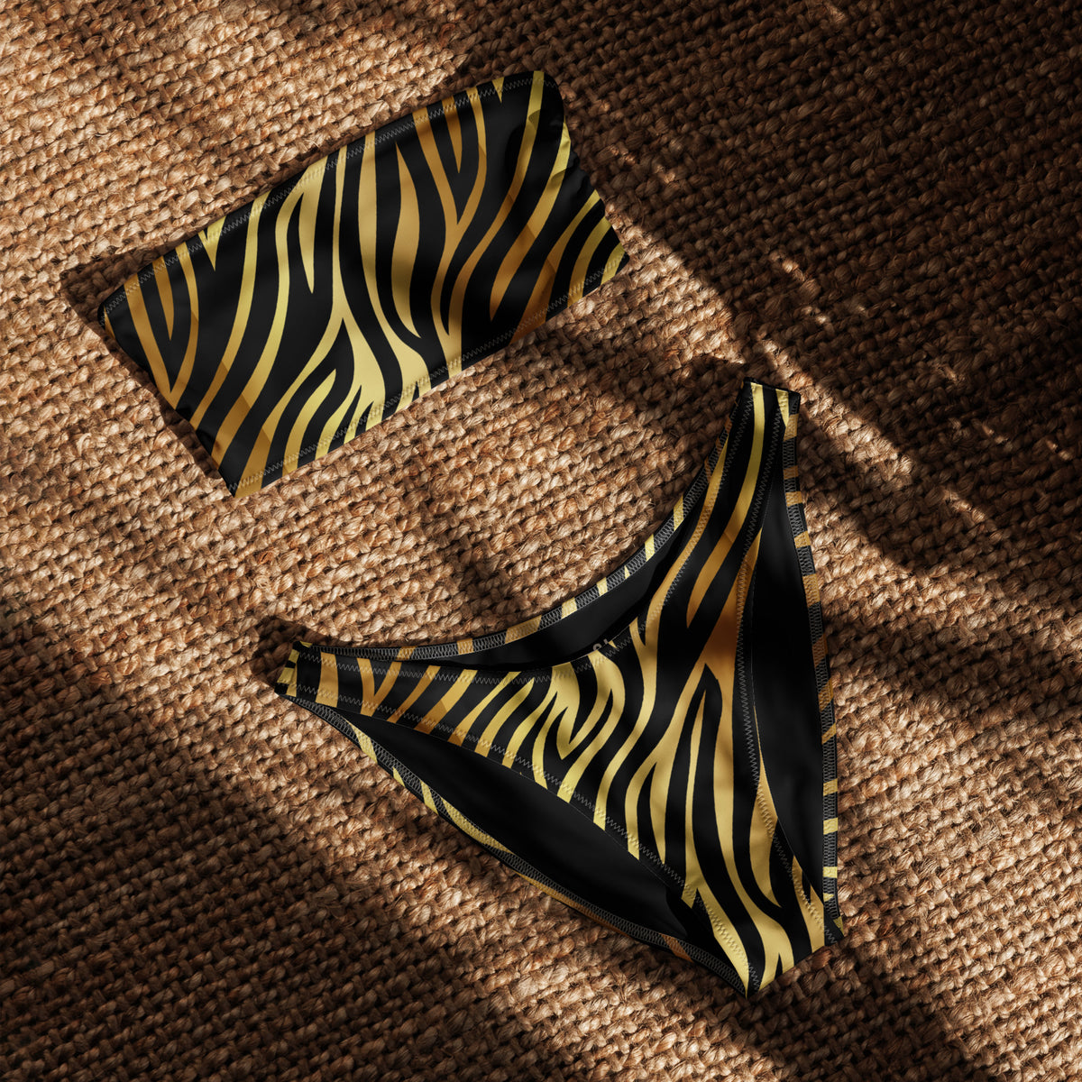 Black and gold zebra print bandeau bikini with strapless top and V-cut high-leg bottom