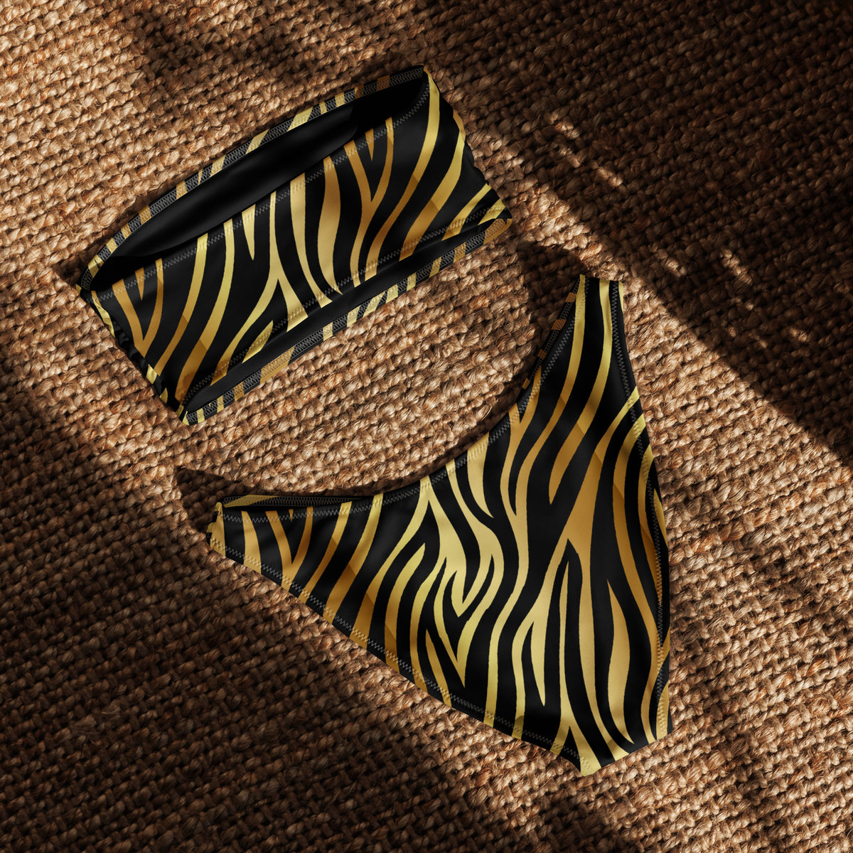 Black and gold zebra print bandeau bikini with strapless top and V-cut high-leg bottom
