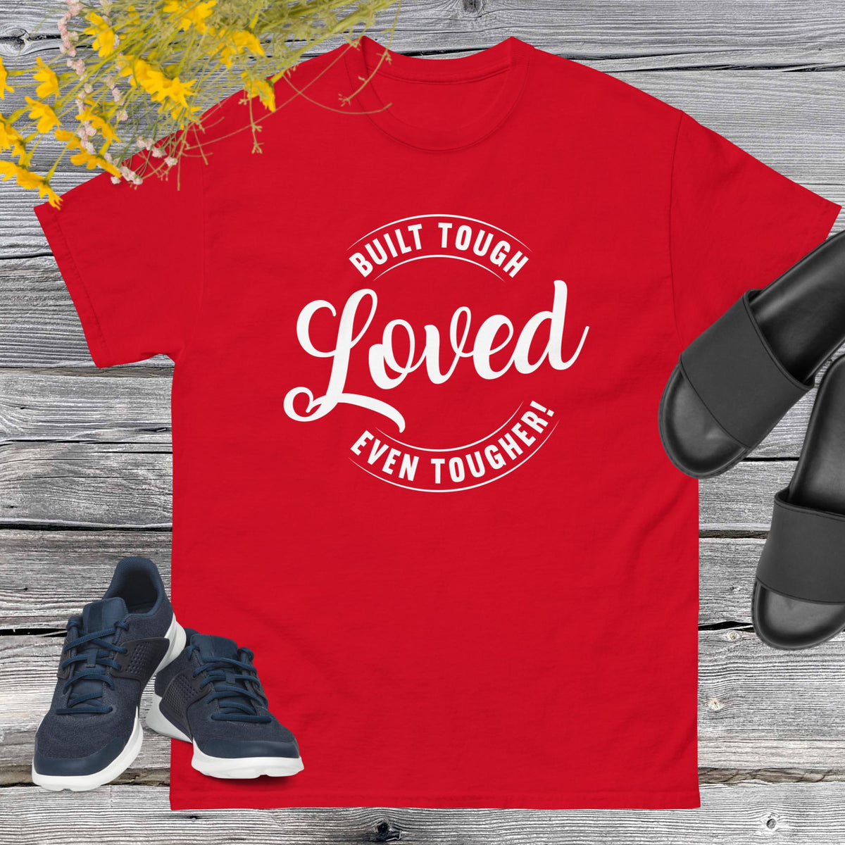 "Built Tough, Loved Even Tougher" T-shirt is bold yet heartwarming quote emblazoned on the front speaks volumes about the resilience and love inherent in fatherhood. Whether he's fixing things around the house, giving sage advice, or simply being there through thick and thin, this shirt is a testament to the unwavering strength and tenderness of dads everywhere.