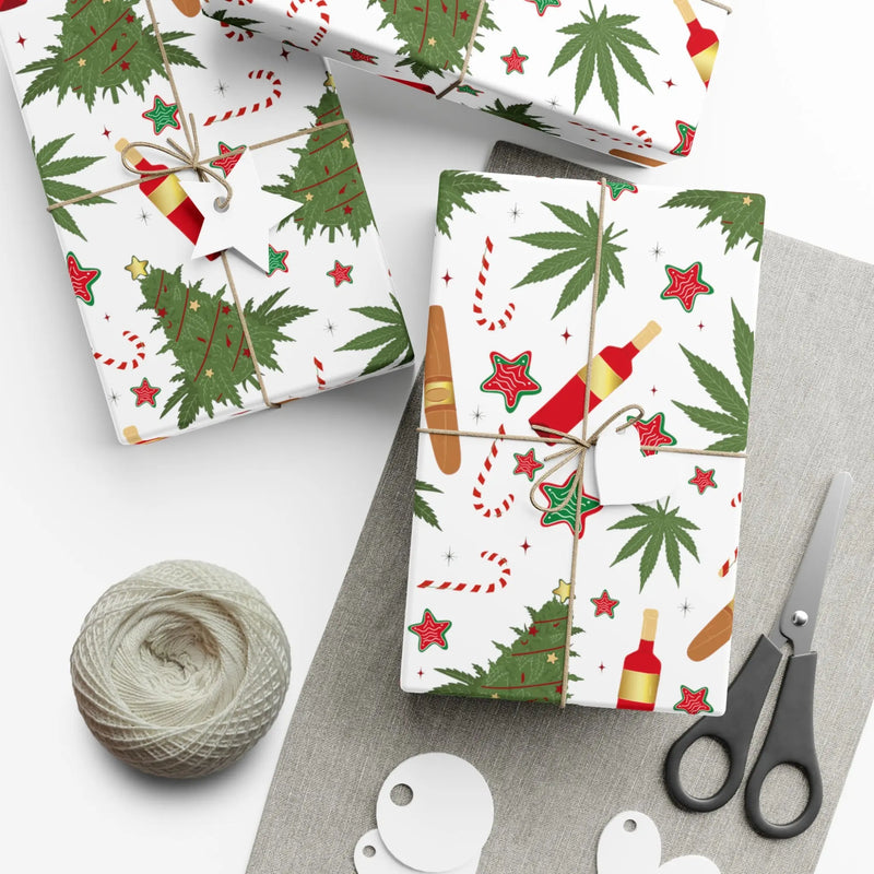 White Christmas wrapping paper featuring cannabis leaves, decorated trees, wine bottles, candy canes, stars, and festive holiday accents