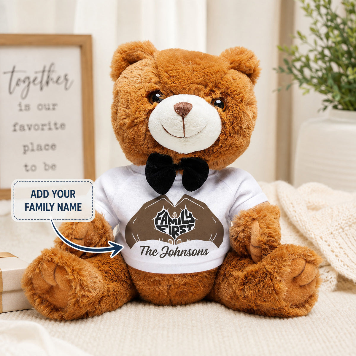 Brown personalized teddy bear wearing a white Family First shirt with custom family name and black bow tie