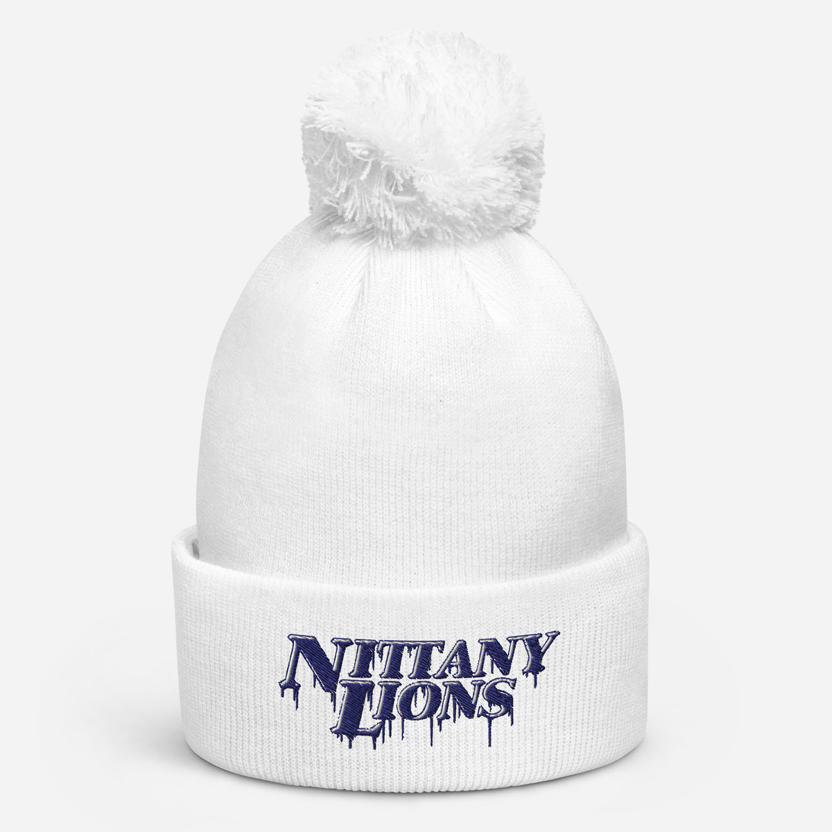 White pom pom beanie with bold embroidered Nittany Lions lettering on the front cuff