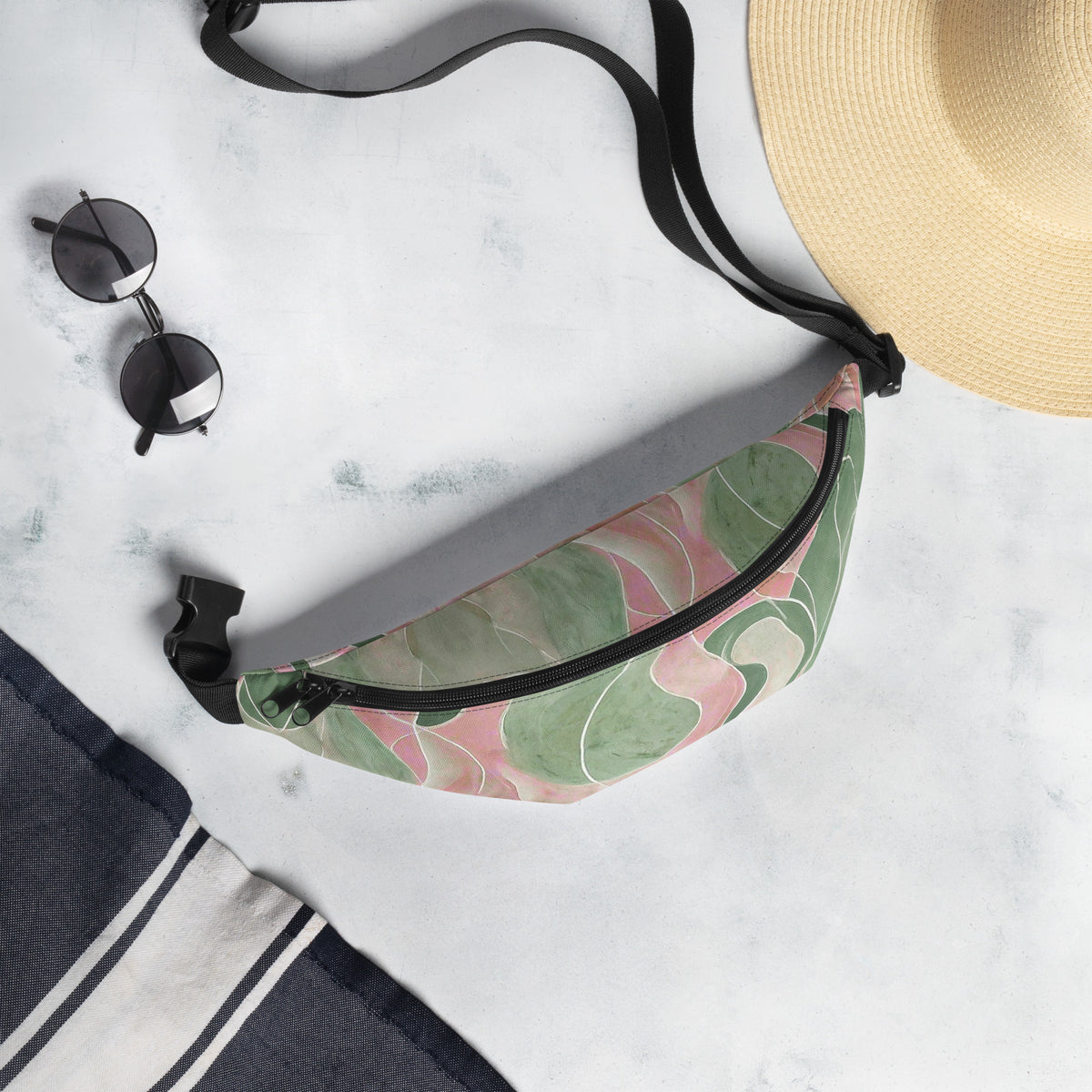 Pink and green marble print fanny pack worn as a retro abstract belt bag