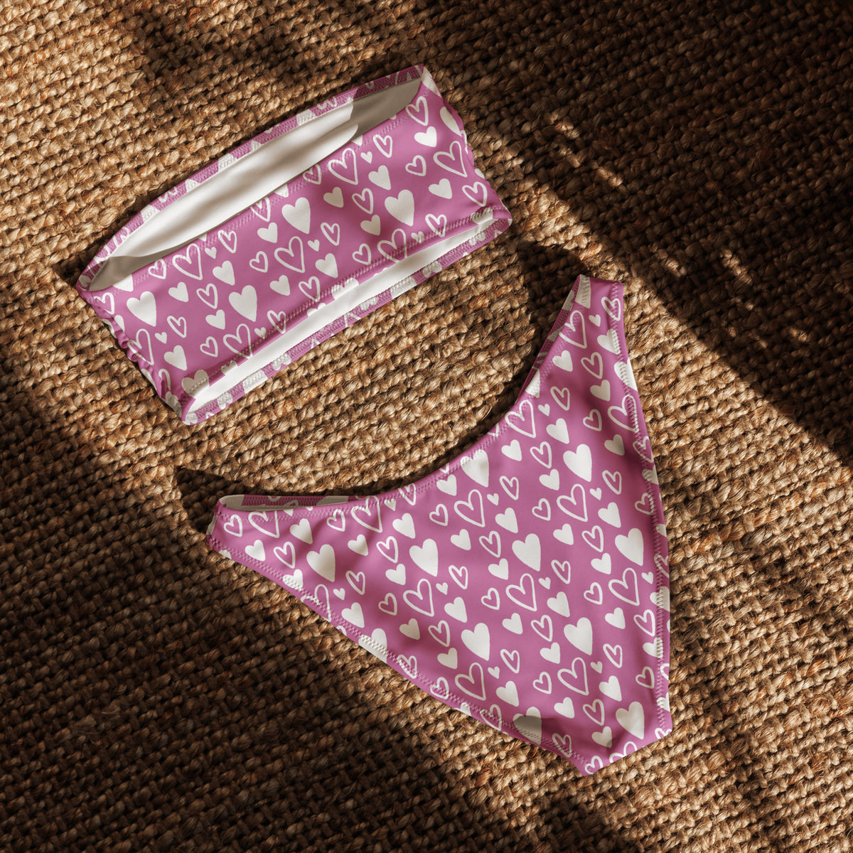 Pink and white heart print bandeau bikini with strapless top and high-waist high-leg bottom