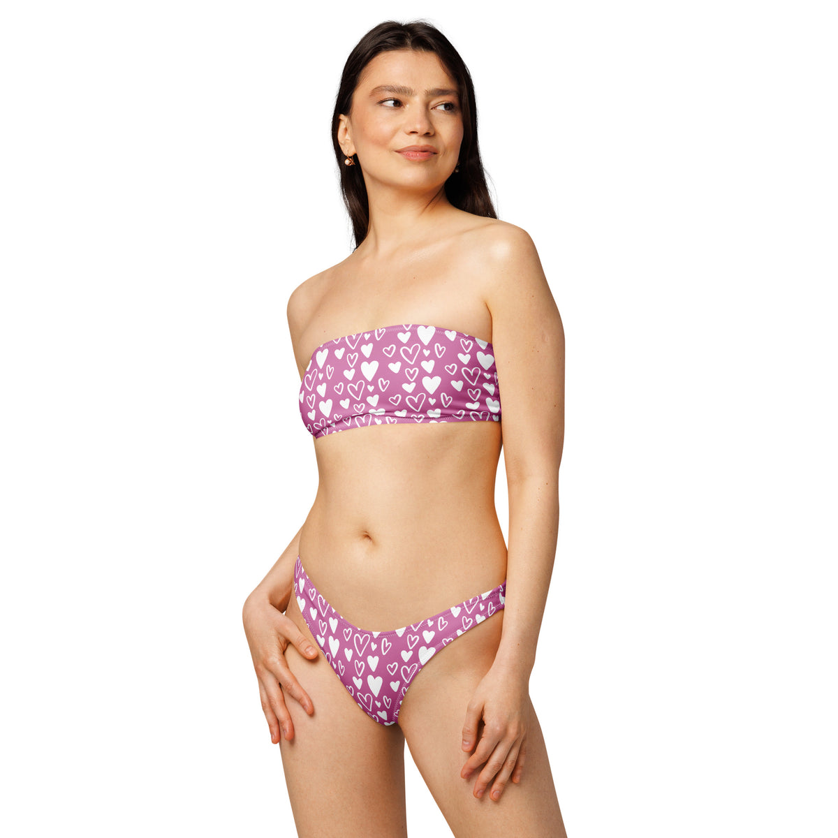 Model wearing a Pink and white heart print bandeau bikini with strapless top and high-waist high-leg bottom