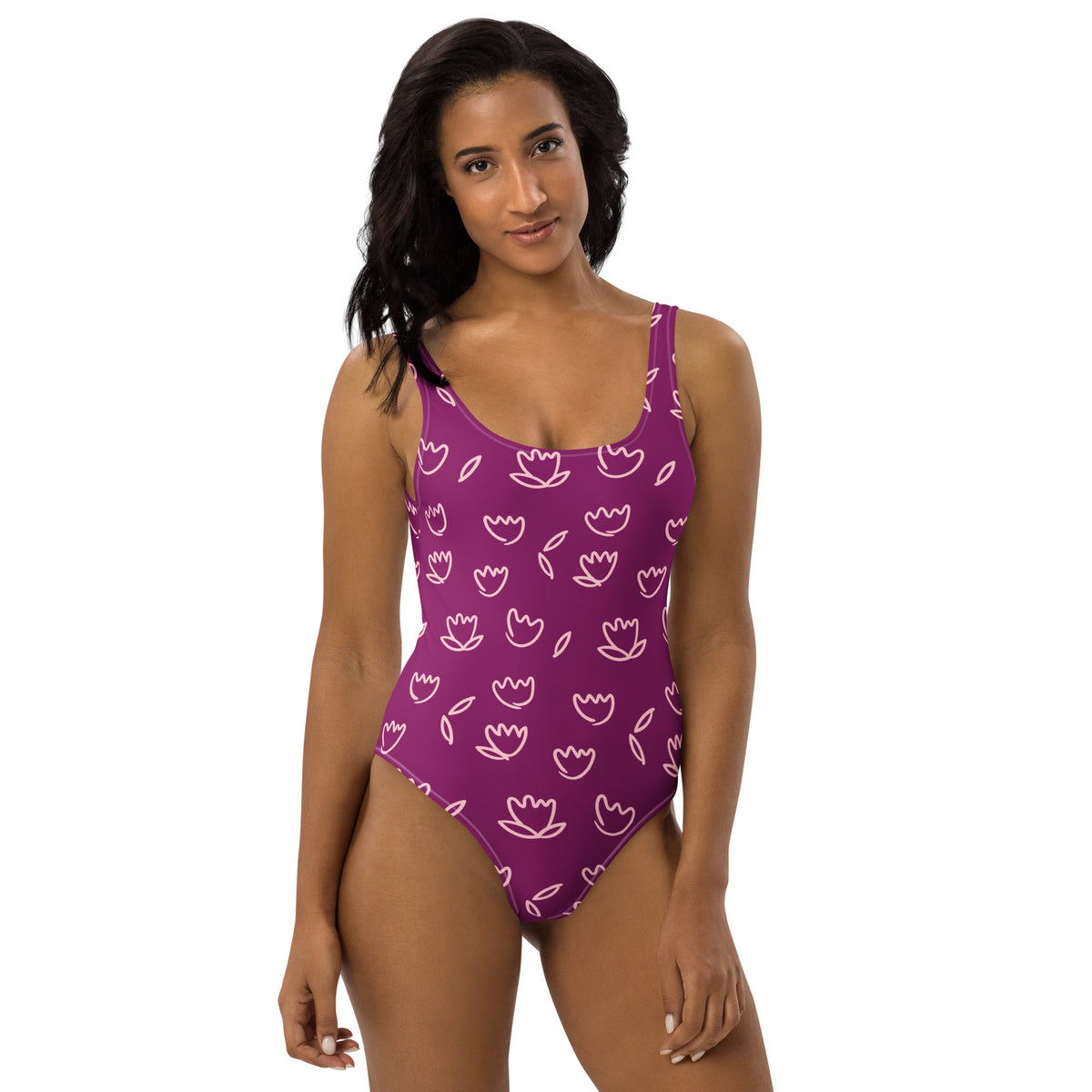 Model wearing Purple one-piece swimsuit with light pink tulip floral print and scoop necklineckup