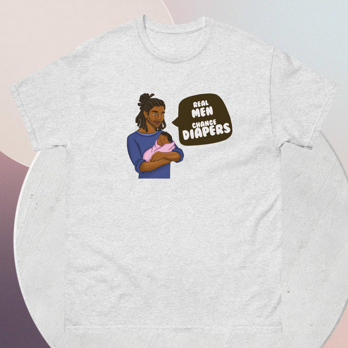 The striking light grey t-shirt features an African American dad tenderly cradling his infant, a powerful testament to the strength, love, and nurturing spirit of fatherhood. Accompanying this heartwarming image is the empowering quote: "Real Men Change Diapers" - a rallying cry for breaking stereotypes and embracing the hands-on role of dads in childcare.