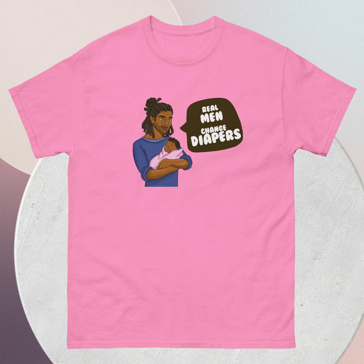 The striking pink t-shirt features an African American dad tenderly cradling his infant, a powerful testament to the strength, love, and nurturing spirit of fatherhood. Accompanying this heartwarming image is the empowering quote: "Real Men Change Diapers" - a rallying cry for breaking stereotypes and embracing the hands-on role of dads in childcare.