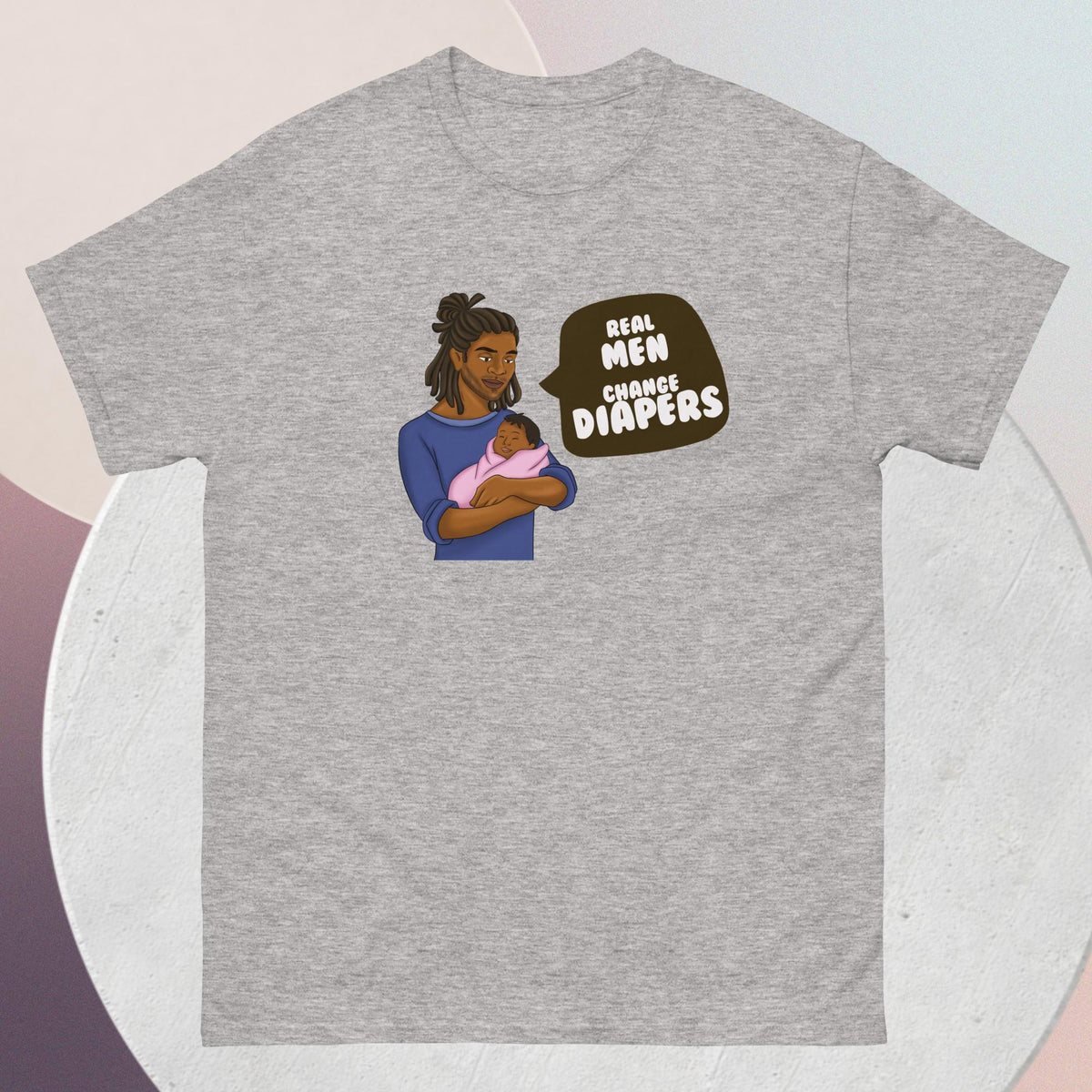 The striking grey t-shirt features an African American dad tenderly cradling his infant, a powerful testament to the strength, love, and nurturing spirit of fatherhood. Accompanying this heartwarming image is the empowering quote: "Real Men Change Diapers" - a rallying cry for breaking stereotypes and embracing the hands-on role of dads in childcare.