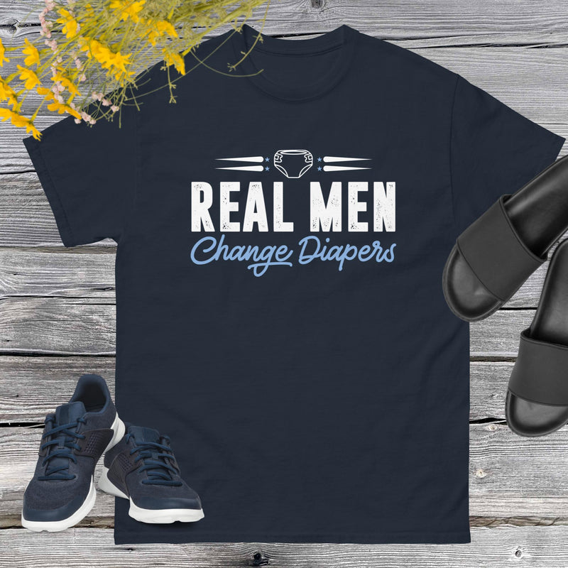 Celebrate fatherhood with our exclusive Father's Day navy blue t-shirt! Crafted from 100% premium cotton, showcasing a bold statement: "Real Men Change Diapers." A declaration of modern fatherhood proudly proclaiming that changing diapers is not just a mom's job—it's a real man's duty!