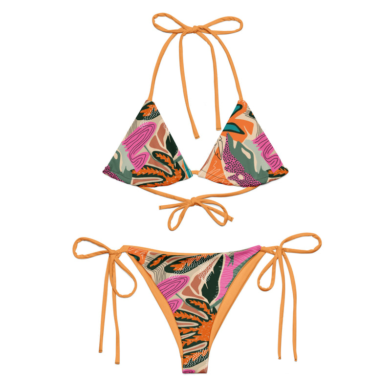 Tropical print two-piece string bikini with tangerine ties, triangle top, and tie-side bottoms