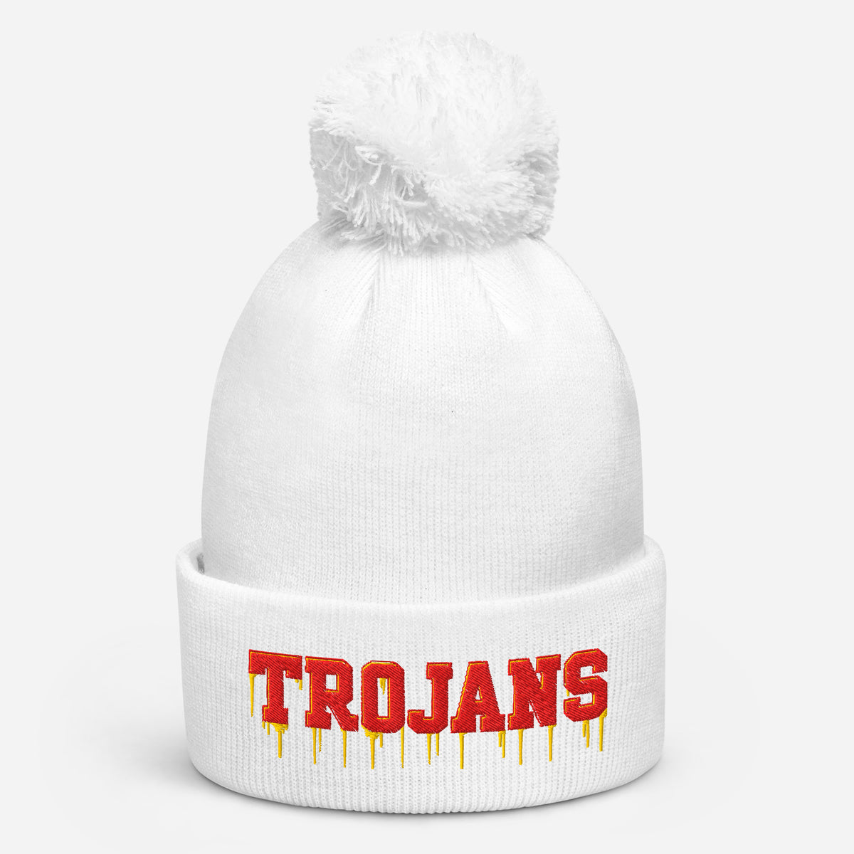 White pom pom beanie with bold embroidered Trojans lettering on the front cuff