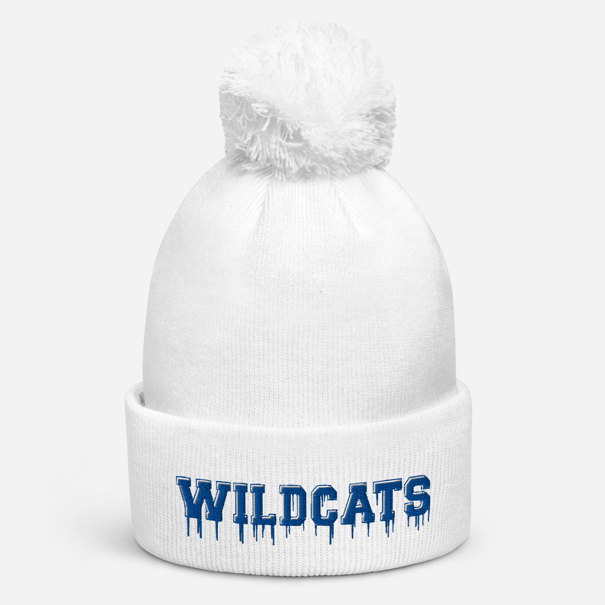 White pom pom beanie with bold blue embroidered Wildcats lettering on the front cuff