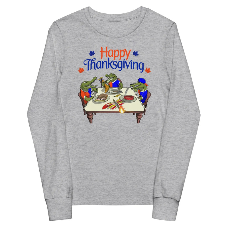 Youth long sleeve grey Thanksgiving shirt featuring Gator-themed rivalry design with festive fall elements and Thanksgiving table art