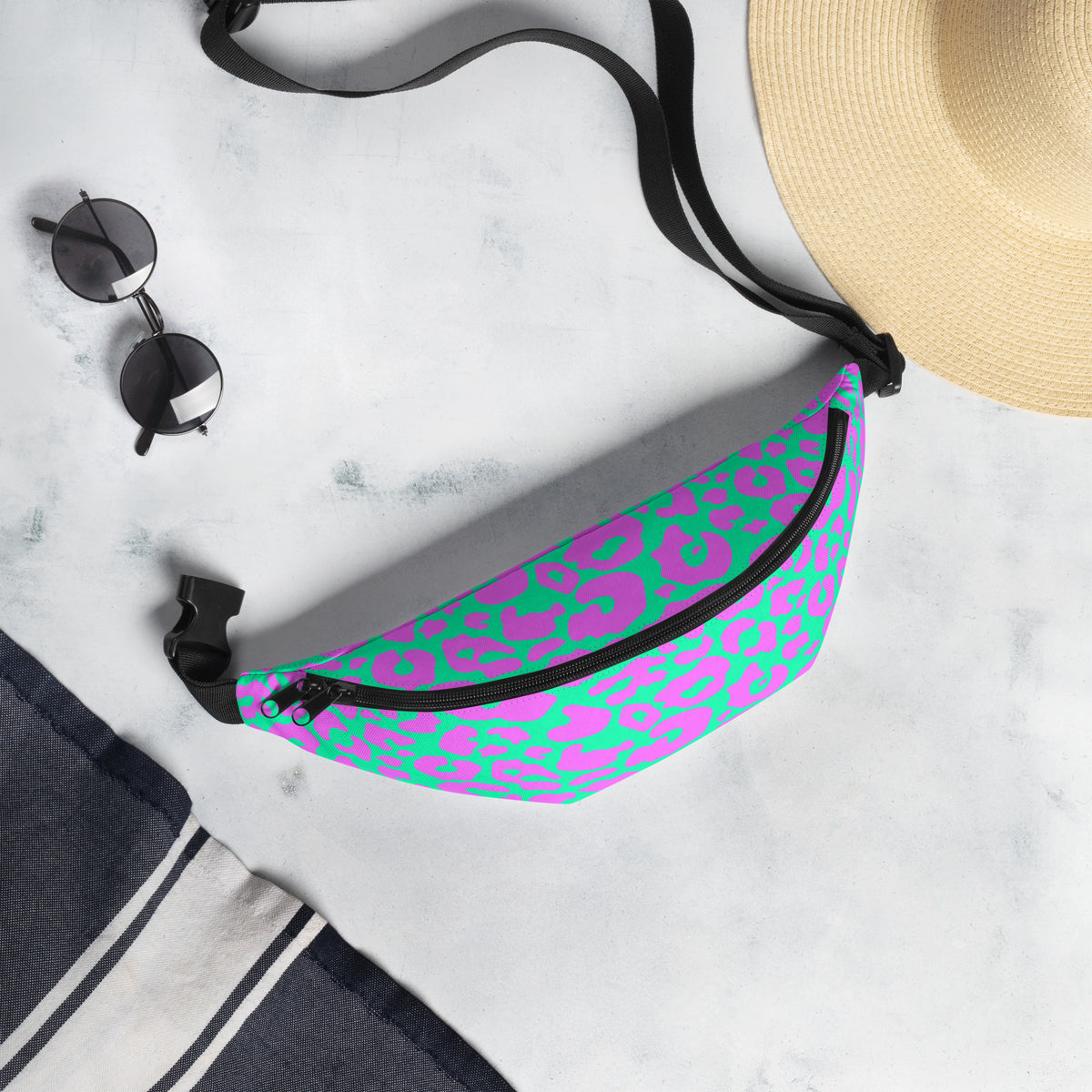 Pink and aqua cheetah print fanny pack worn as a belt bag