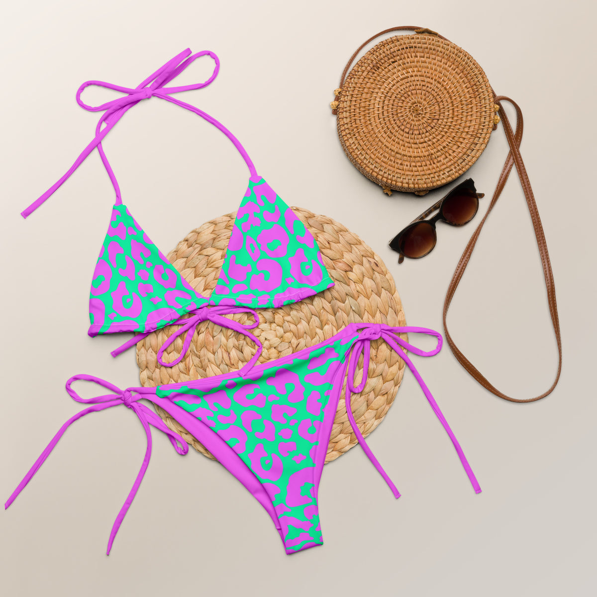 Mockup of a pink and aqua cheetah print two-piece string bikini with triangle top and tie-side bottoms