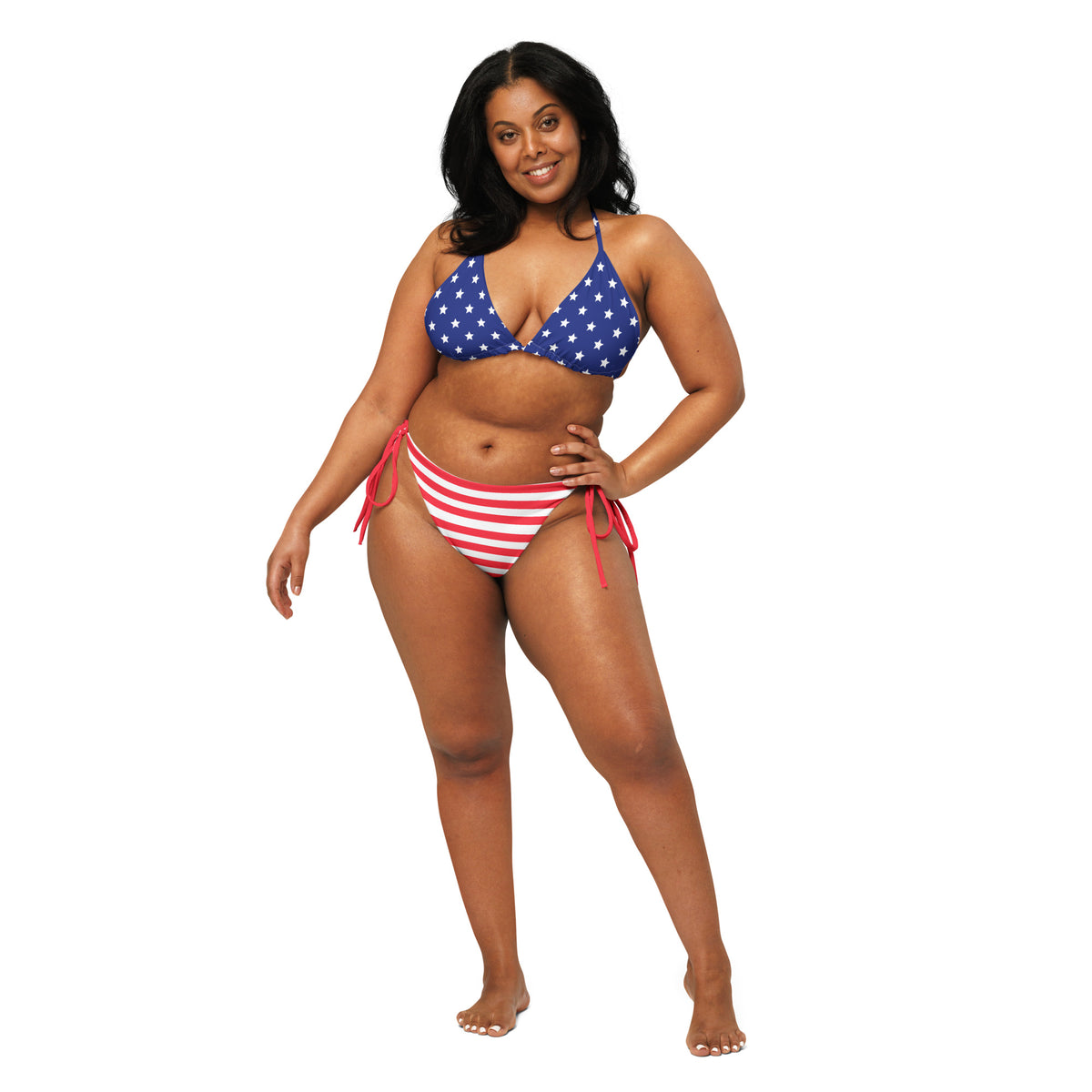 Model wearing Patriotic two-piece string bikini with blue star triangle top and red-and-white striped tie-side bottoms