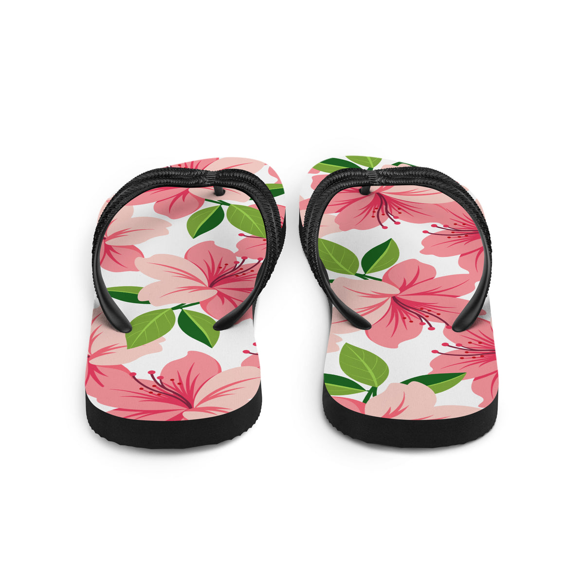 Pink floral print flip-flops with black straps and tropical flower design