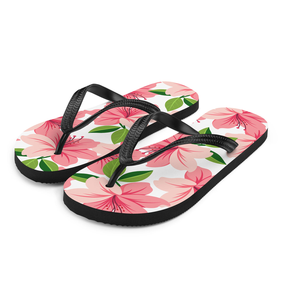 Pink floral print flip-flops with black straps and tropical flower design