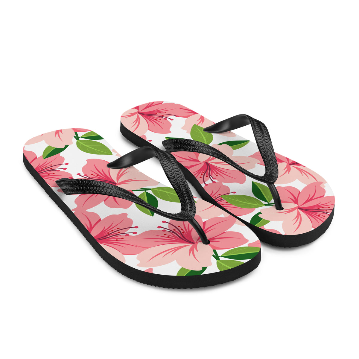 Pink floral print flip-flops with black straps and tropical flower design