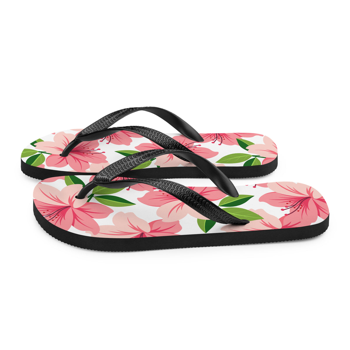 Pink floral print flip-flops with black straps and tropical flower design