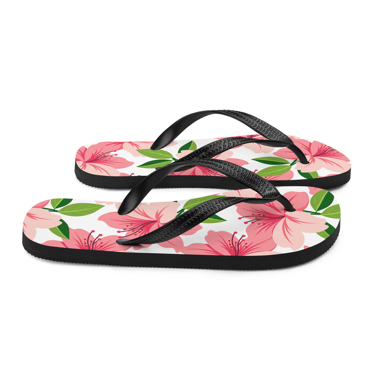 Pink floral print flip-flops with black straps and tropical flower design