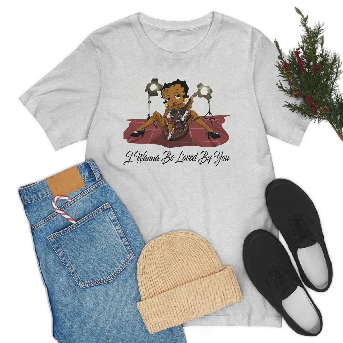 Ash Betty Boop graphic T-shirt featuring her playing an electric guitar under stage lights with I Wanna Be Loved By You text
