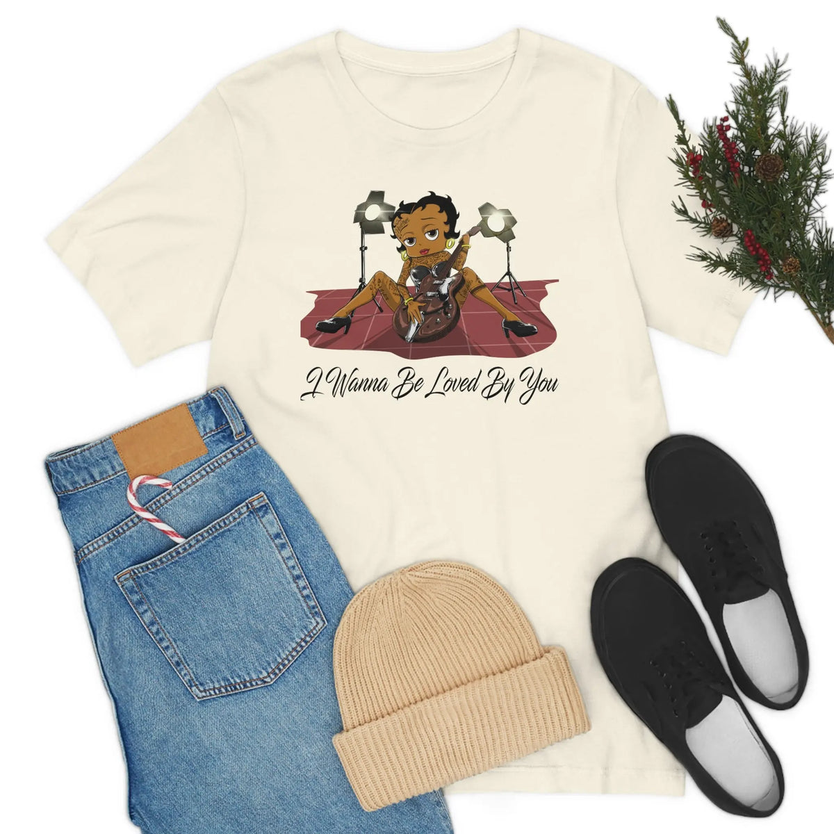 Natural Betty Boop graphic T-shirt featuring her playing an electric guitar under stage lights with I Wanna Be Loved By You text