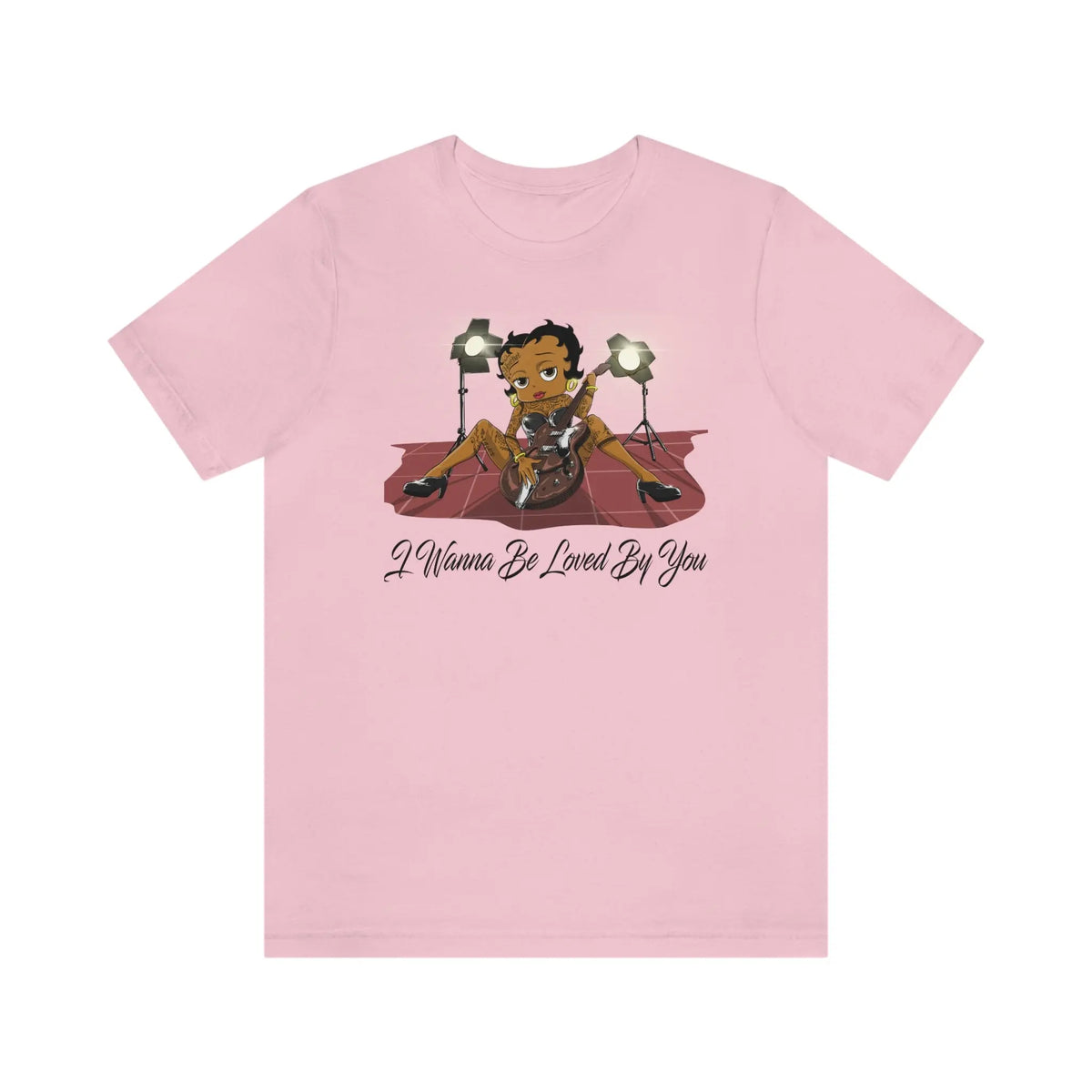 Pink Betty Boop graphic T-shirt featuring her playing an electric guitar under stage lights with I Wanna Be Loved By You text